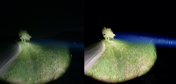 Verlgeich zweier Lichtkegel einer Taschenlampe bei Nacht auf einer Wiese